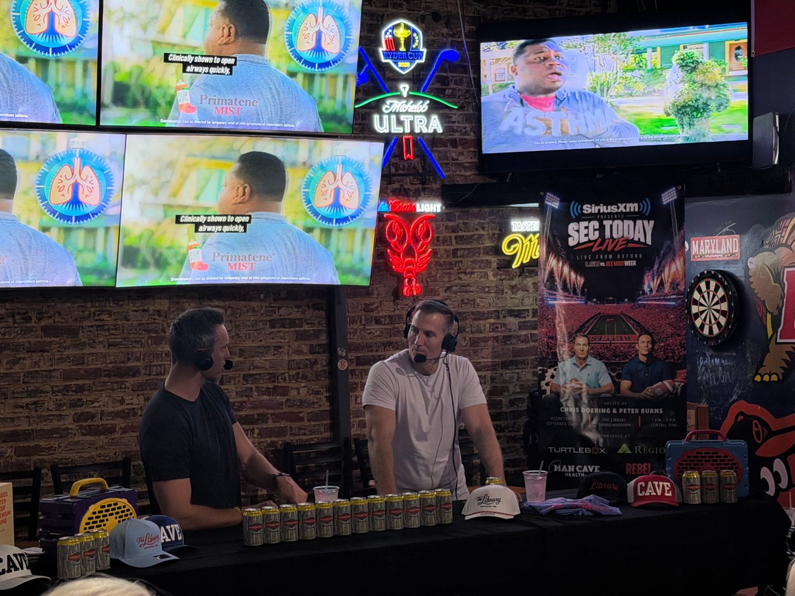 The banner framing the hosts' set during the live broadcast